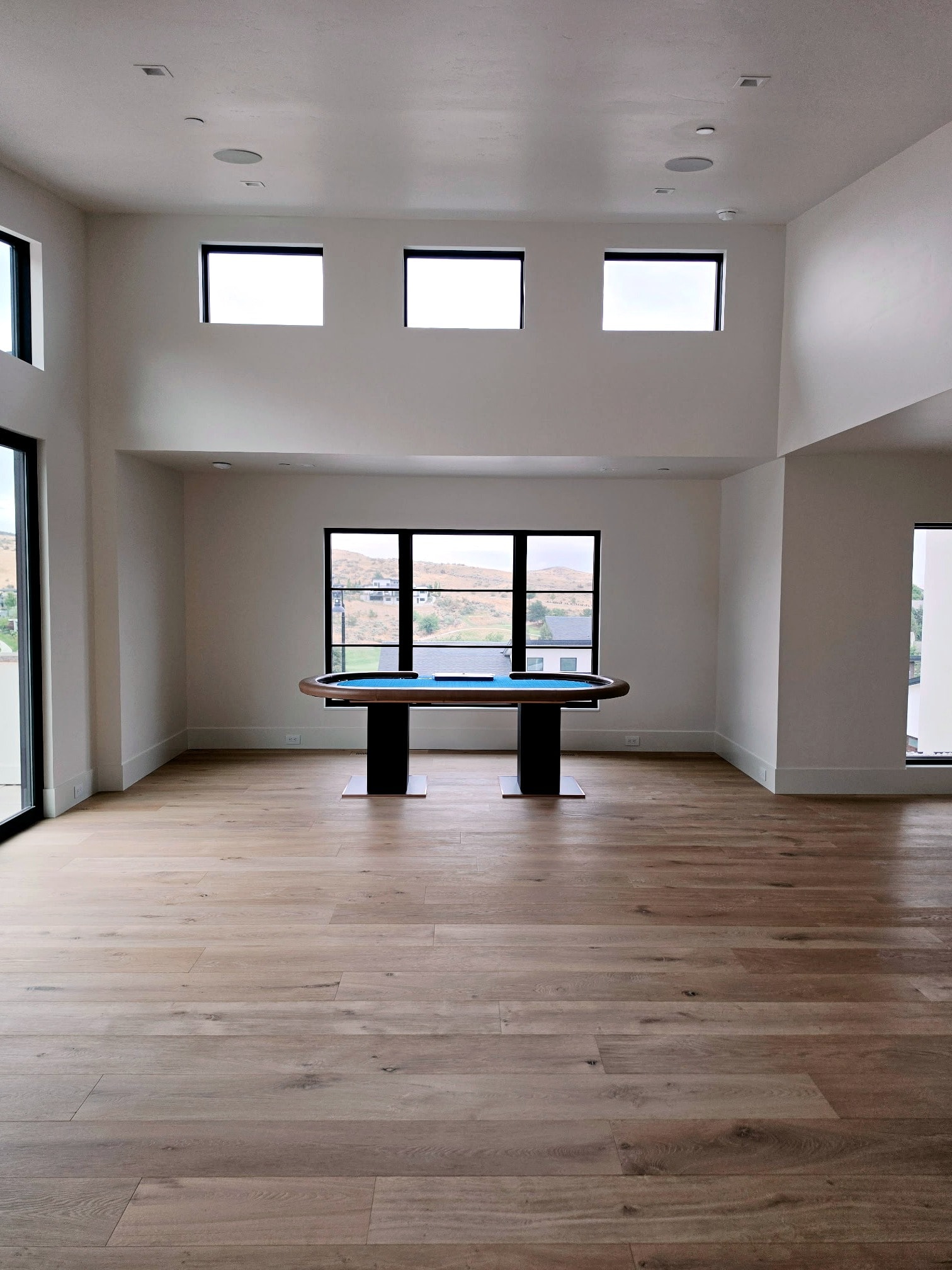 Hillside Haven bonus room — high ceilings, clerestory windows, and flawlessly painted walls