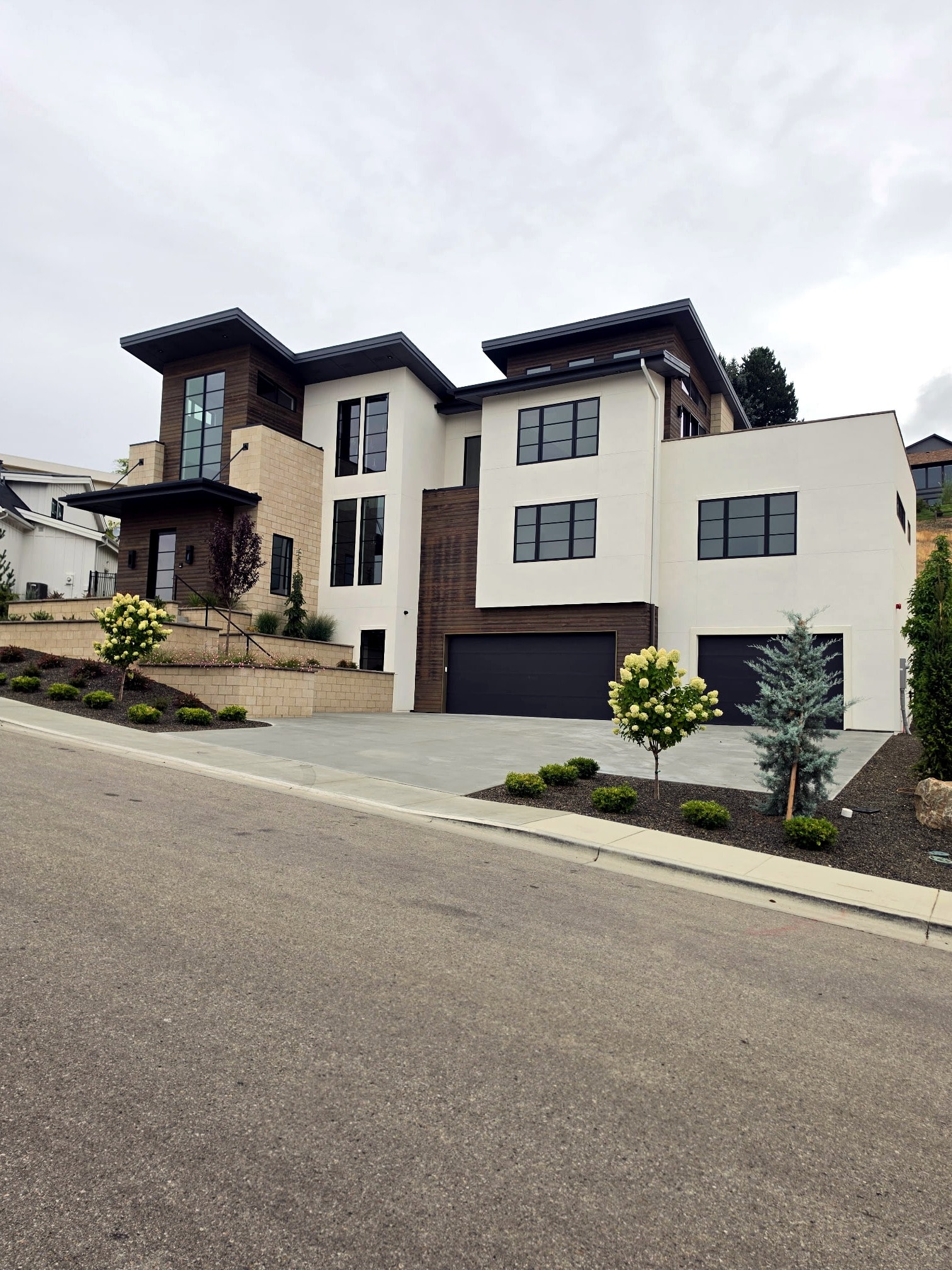 Hillside Haven full street view — completed custom home exterior with flawless painted finish