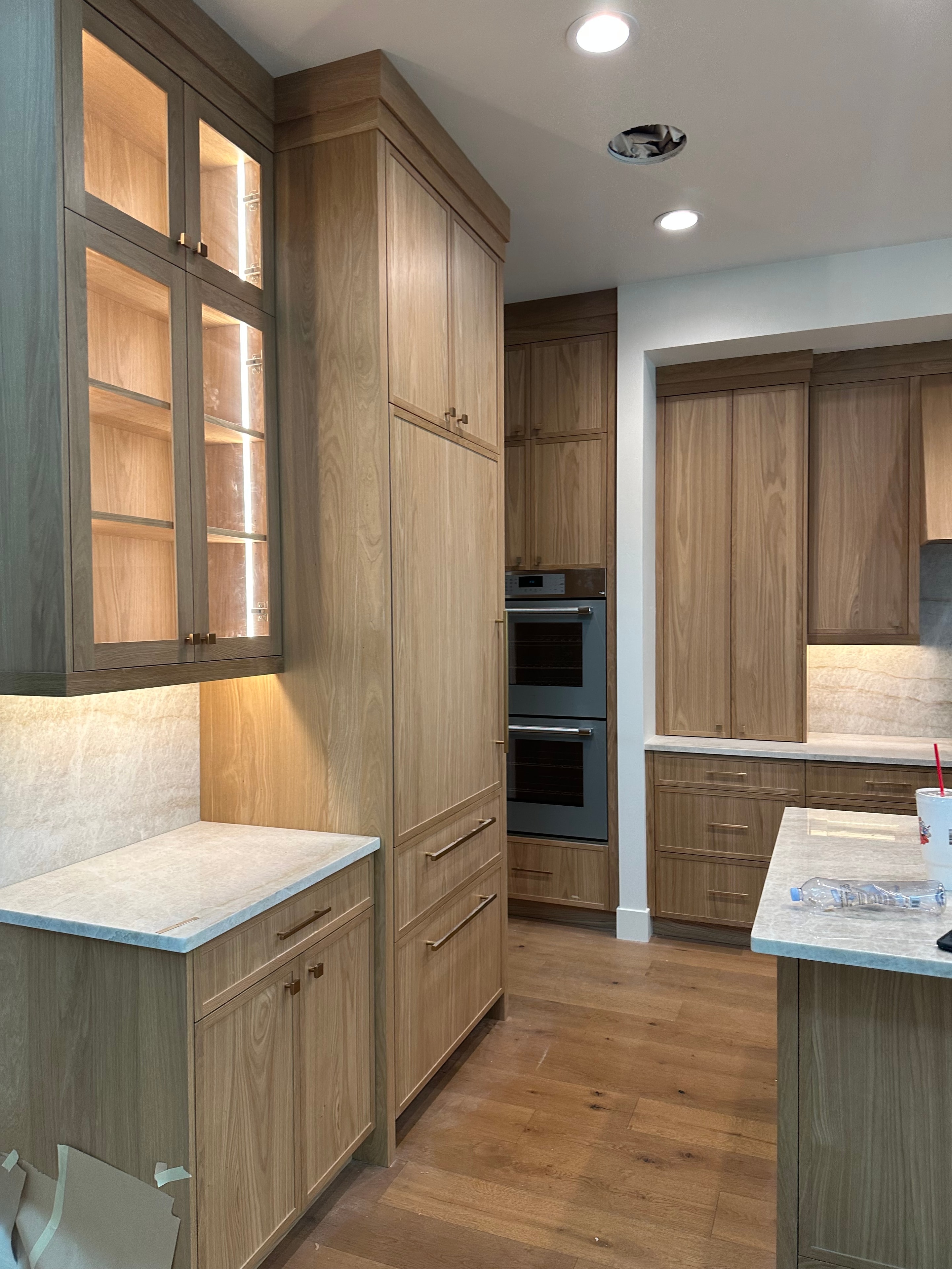 Beautifully finished kitchen with warm wood cabinetry and clean painted walls